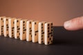 Finger pushing dominoes Royalty Free Stock Photo