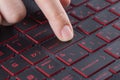 Finger pushing enter button on laptop keyboard Royalty Free Stock Photo