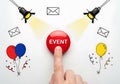 Finger pushing event button with spotlight and balloons concept for announcement or celebration Royalty Free Stock Photo