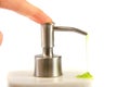 Finger pushing liquid soap pump Royalty Free Stock Photo