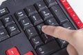 Finger pushing number button on keyboard of computer Royalty Free Stock Photo