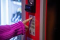 Finger pushing number button on vending machine Royalty Free Stock Photo