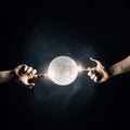 Finger reaching moon planet Royalty Free Stock Photo