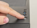 Finger is ready to press down the On Off button on the personal computer system unit. Power button on the top of desktop PC tower Royalty Free Stock Photo