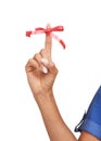 Finger, ribbon and red bow on for reminder of event, commitment or sign remember task in studio. Attention, symbol and Royalty Free Stock Photo