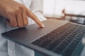 Finger`s businessman use trackpad on laptop