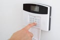 Finger setting security alarm Royalty Free Stock Photo