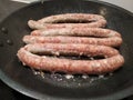 Finger shoved sausage. home-made, rustic meat food in a natural shell. BBQ, for cooking on the grill, skorovoda or fire Royalty Free Stock Photo