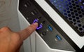 Finger about to press a power button. Hardware equipment concept. Composite between an image Royalty Free Stock Photo