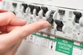 Finger About to Switch on LIghting Through RCD Circuit Breaker Royalty Free Stock Photo