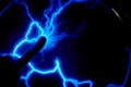 Finger touch electric plasma ball on a dark background. Static electricity model Royalty Free Stock Photo