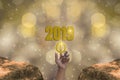 Finger Touch the start button to Starting 2019 Brightness Theme of Gold,happy new year with sparkling golden light bokeh and Royalty Free Stock Photo