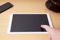 Finger touching blank touchscreen on tablet computer