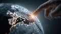 Finger touching digital earth with glowing network connections in dark space Royalty Free Stock Photo