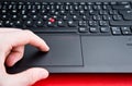 Finger touching touchpad on laptop Royalty Free Stock Photo