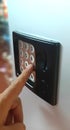 Finger push a button and select a product on a vending machine Royalty Free Stock Photo