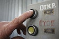 Finger of worker pushing button Open on a control panel Royalty Free Stock Photo