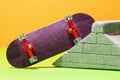Fingerboard and plaster ramp on a colored background, close-up Royalty Free Stock Photo