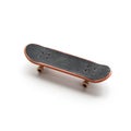 Fingerboard. A small skateboard. Close up. Isolated on white background