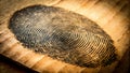 Fingerprint on old book. Shallow depth of field Royalty Free Stock Photo