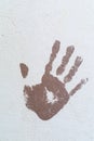 Handprint on the plastered wall. Stop concept.