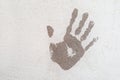 Handprint on the plastered wall. Stop concept