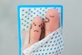 Fingers art of couple in bedroom. Concept of snoring husband annoys his wife