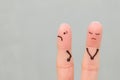 Fingers art of displeased couple. Woman was offended, man was guilty