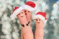 Fingers art of family celebrates Christmas. Concept of group of people smiling