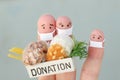 Fingers art of family with face mask. Man  and woman holding donation box with food Royalty Free Stock Photo