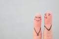 Fingers art of happy couple. Concept of man blows kiss, woman is embarrassed