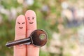 Fingers art of happy couple. Family holds house key