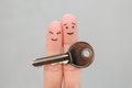 Fingers art of happy couple. Family holds house key