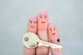 Fingers art of happy couple. Family holds house key