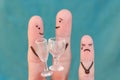 Fingers art of happy couple. Man and woman drink alcoholic beverages. Child is angry and resentful