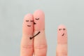 Fingers art of happy family. Concept of couple kisses, child glances after them Royalty Free Stock Photo
