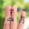 Fingers art of happy family. Concept of couple kisses, child spies on them