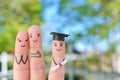 Fingers art of happy family. Concept parents are proud of their child graduated from college Royalty Free Stock Photo