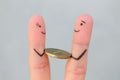 Fingers art of happy people. Concept of man giving bribe