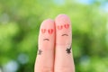 Fingers art of sad couple. Man and woman hug with broken hearts in eyes