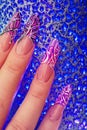 Fingers with beautiful manicure in pink style Royalty Free Stock Photo
