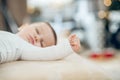 Fingers clenched into fist on hand of sleeping baby Royalty Free Stock Photo