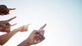 Fingers, closeup and pointing to sky mockup, collaboration and direction for climate change. Group of diverse hands Royalty Free Stock Photo