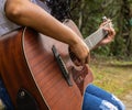 Fingers dancing on the guitar strings Royalty Free Stock Photo