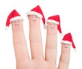 Fingers faces in Santa hats. Happy family celebrating concept