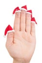 Fingers faces in Santa hats. Happy family celebrating concept