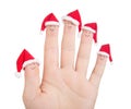 Fingers faces in Santa hats. Happy family celebrating