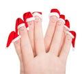 Fingers faces in Santa hats isolated against white. Happy friend