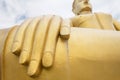 Fingers and hand of golden big buddha statue against sky Royalty Free Stock Photo