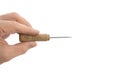 Fingers hand holds a construction tool - awl; sewing tool Royalty Free Stock Photo